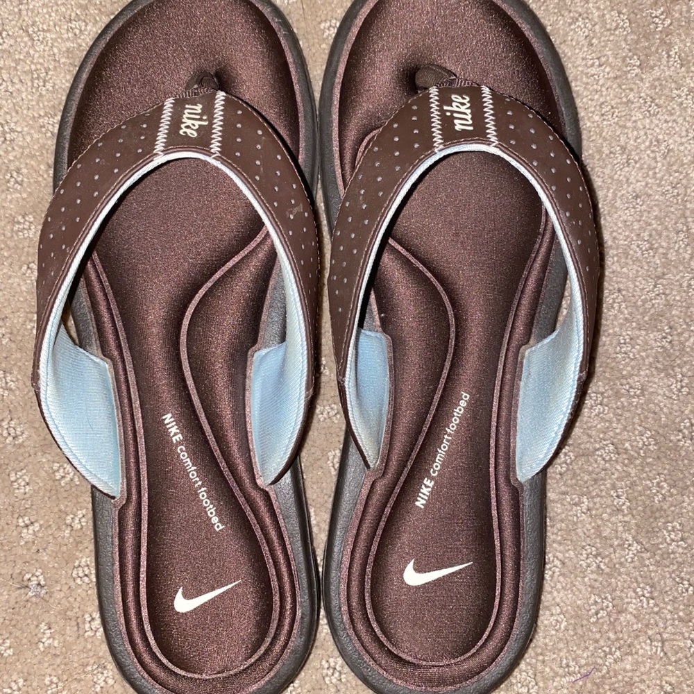 Brown foam Nike flip flops